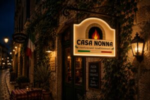 Mockup d'une enseigne lumineuse avec le logo Casa Nonna sur la façade d'un restaurant traditionnel italien.